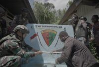 Satgas Pamtas Kewilayahan Yonif 715/Motuliato melalui Pos Ramil Yambi dengan membangun bak penampungan air