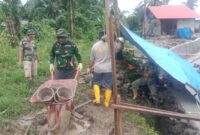 Satgas TMMD 125 Kodim 1506/Namlea dalam melaksanakan kegiatan fisik pembuatan reol sepanjang 315,10 meter di Desa Waenono